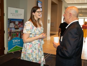 Professional event registration area with check-in tables and promotional displays.