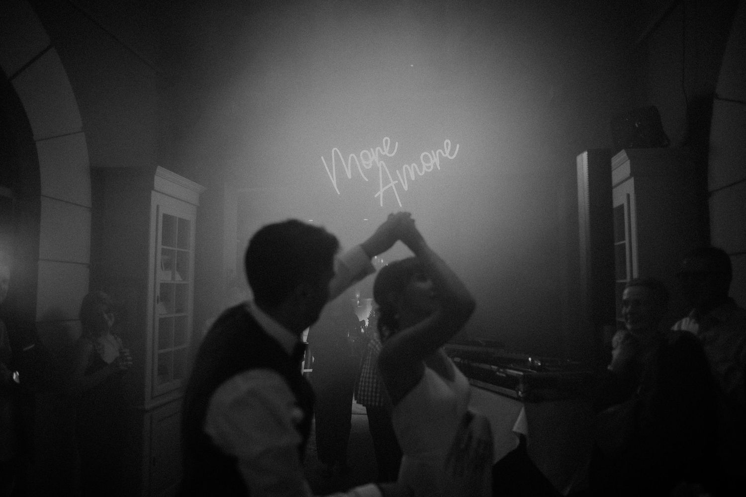 A dark and moody sequence of six black and white film noir style photographs showing shadowy figures in dim lighting.