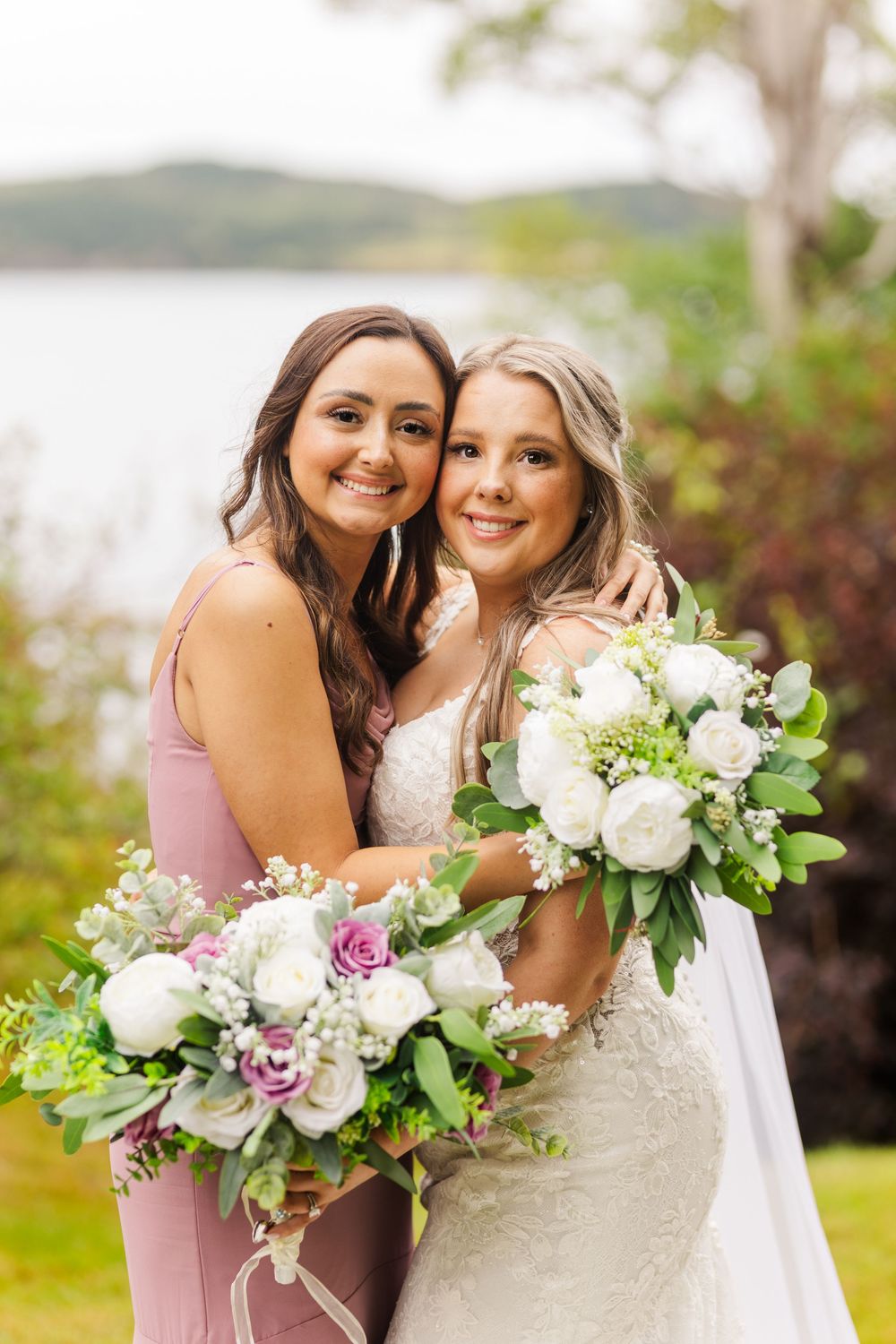 Wedding floral bouquets feature elegant white roses and pink lilies against a natural outdoor backdrop.