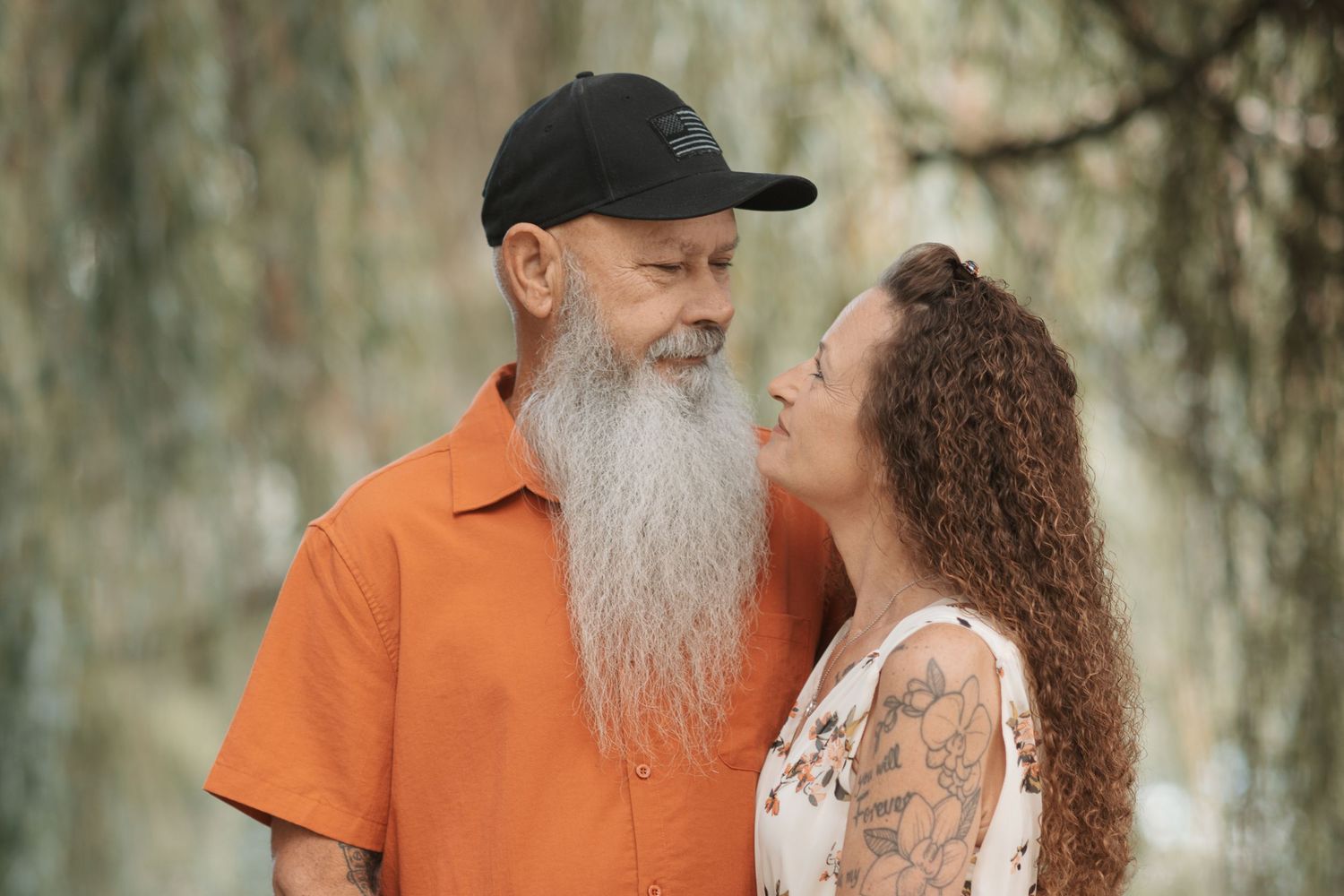 Couple staring into each others eyes while participating in a family photography session in Spokane, Washington.