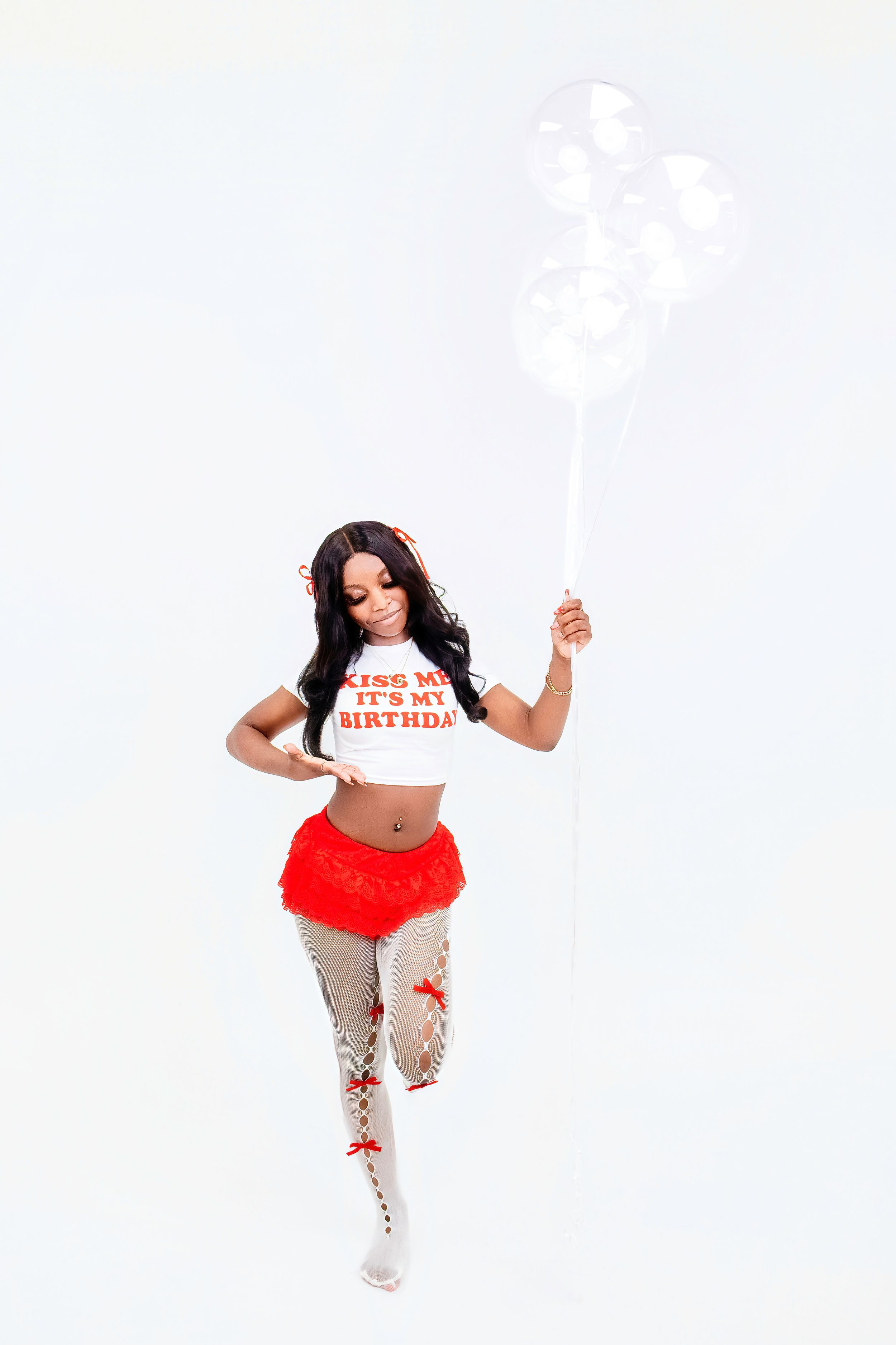 Dynamic dance sequence showing energetic hip-hop moves in red shorts and gray sweatpants against white background.