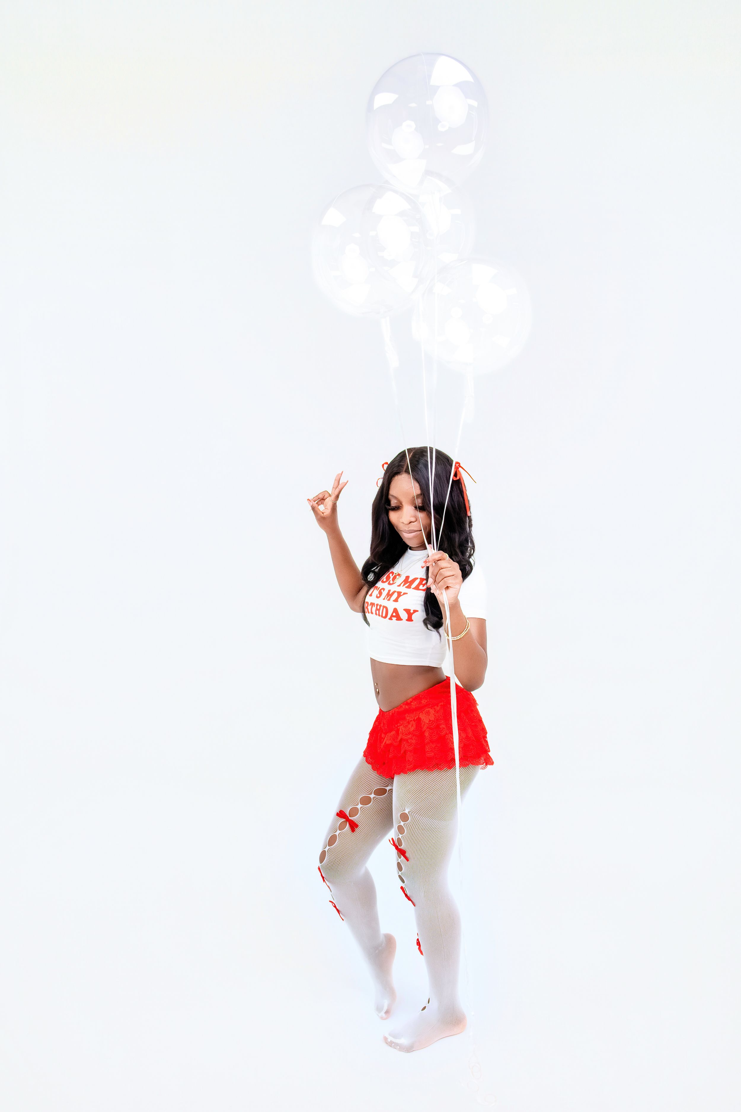 A person in a white and red outfit strikes four dynamic dance poses against a white background.
