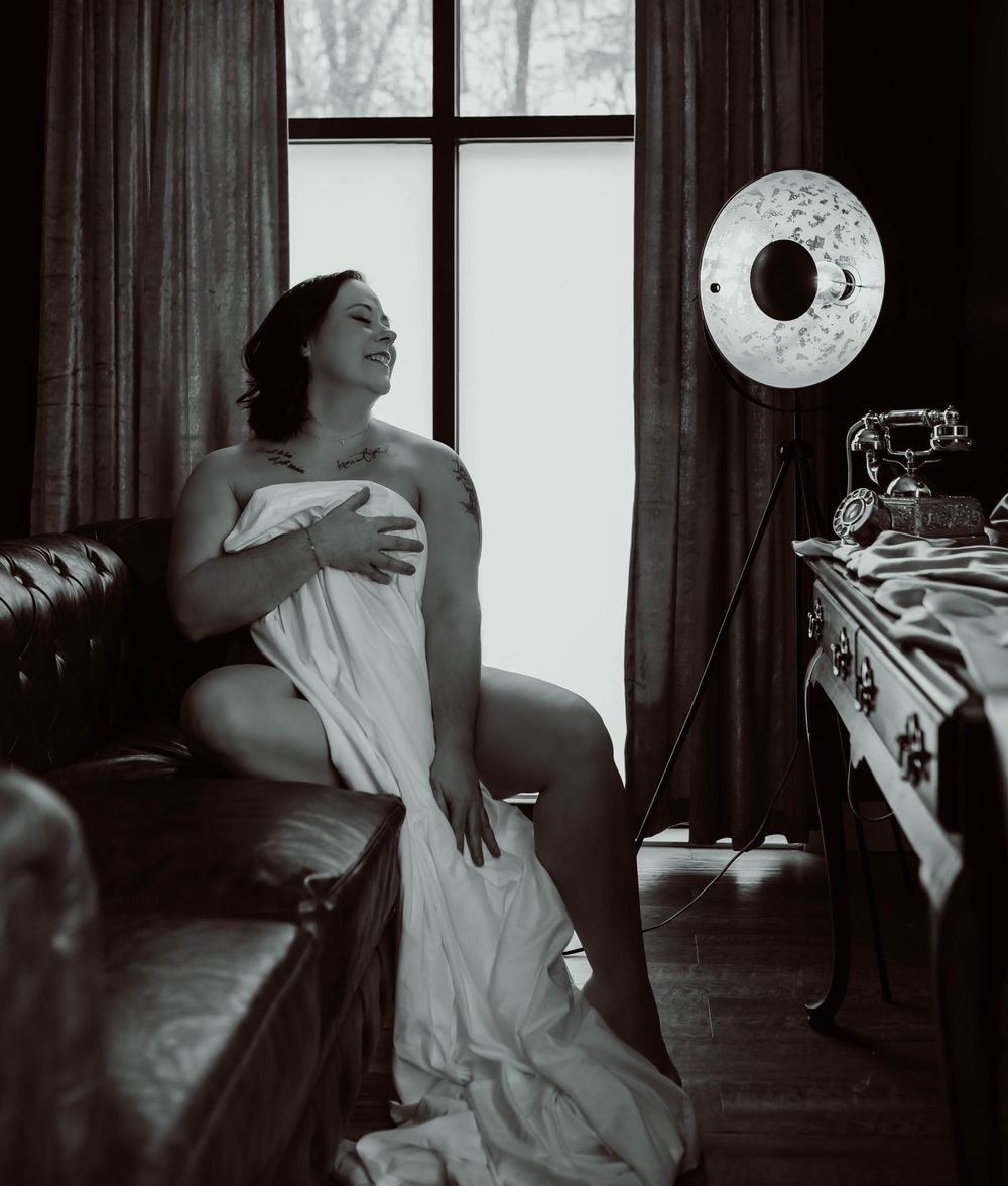 Wisconsin boudoir photography with dark and moody lighting.