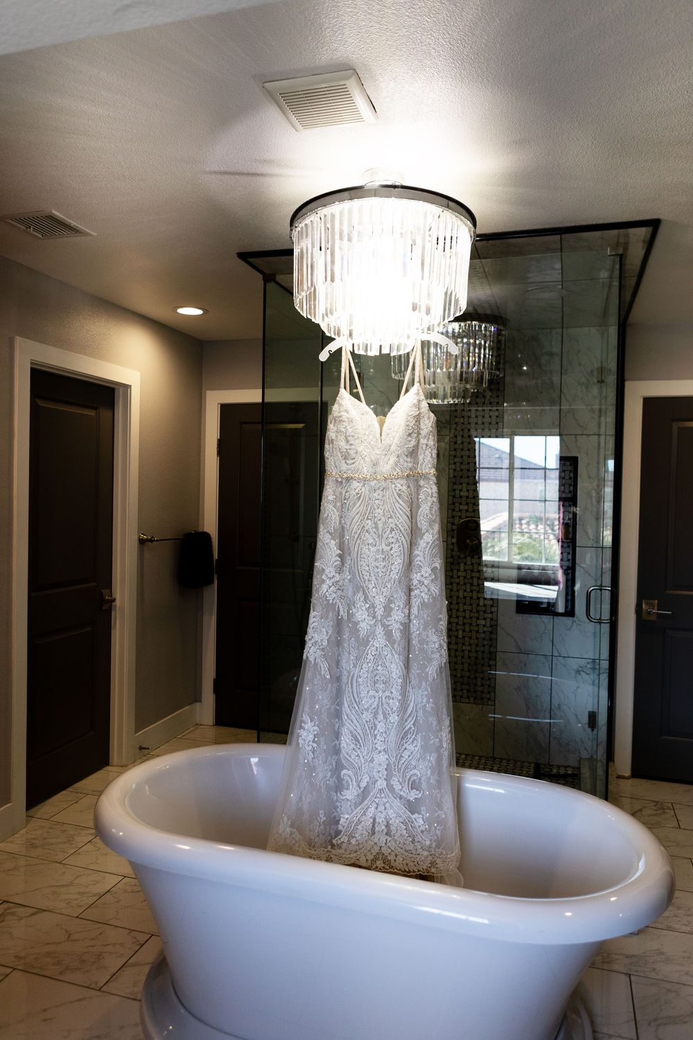 Photos of wedding dress hanging during getting ready photos in Las Vegas