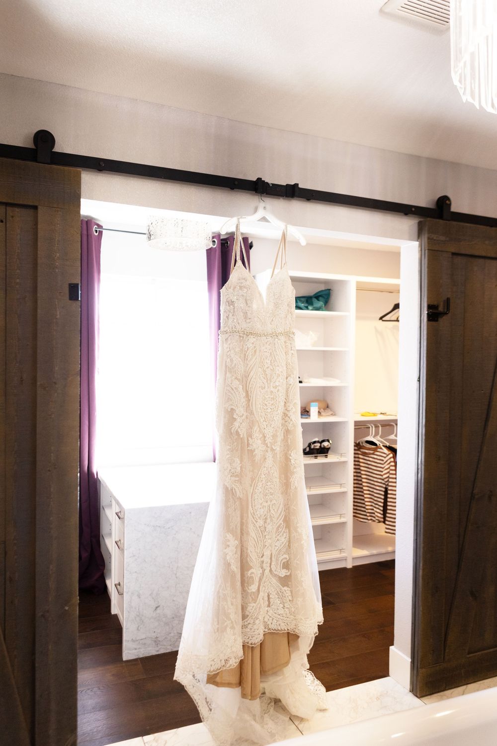 Photos of wedding dress hanging during getting ready photos in Las Vegas