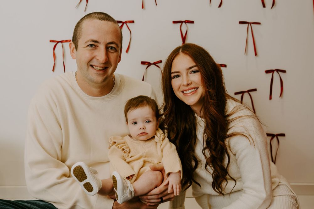 Candid family moments captured in a series of cream-toned photos.