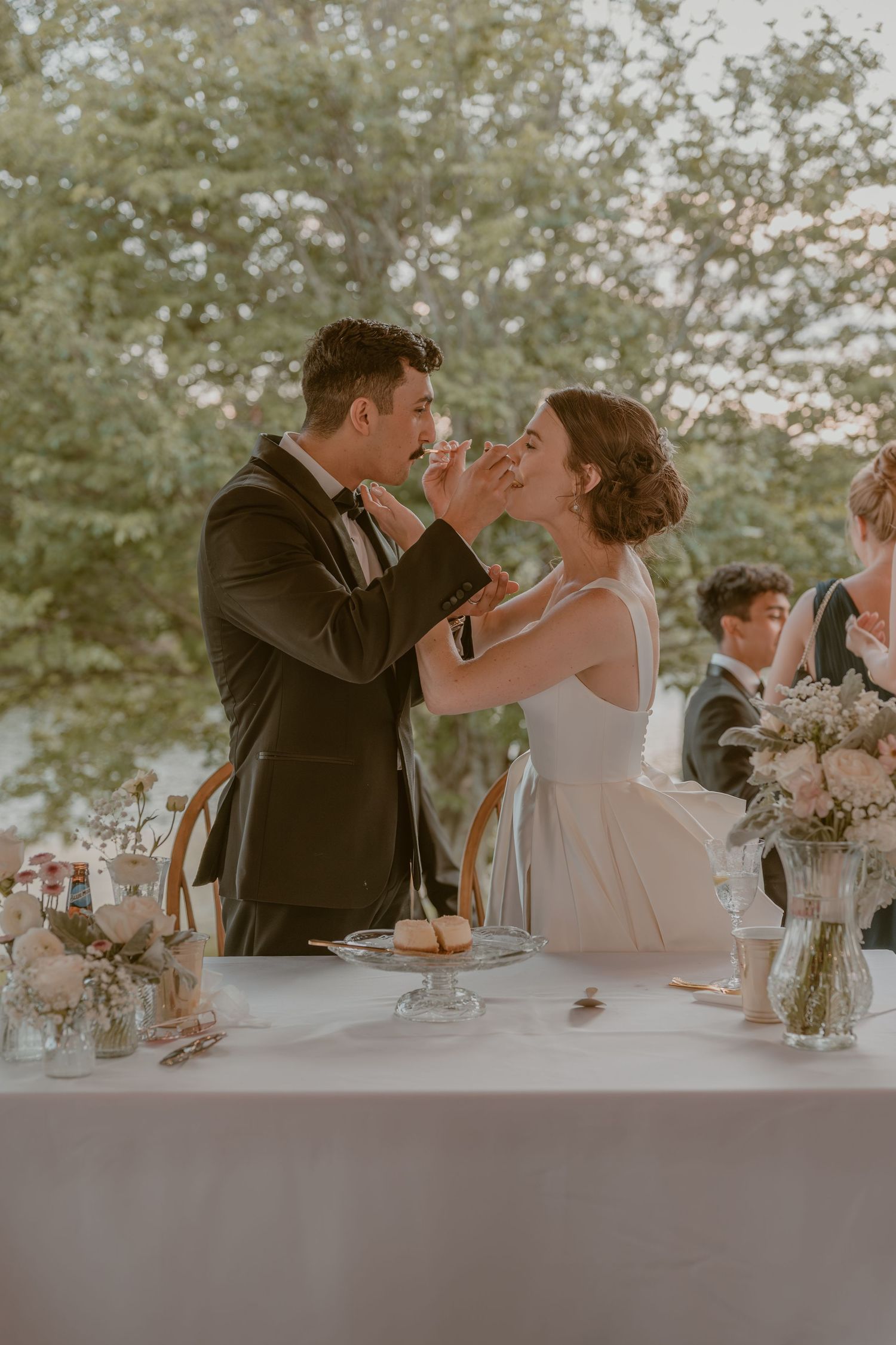 bride and groom cake cutting celebrating at Gaie Lea, Staunton, VA, sharing intimate moments, candid style.