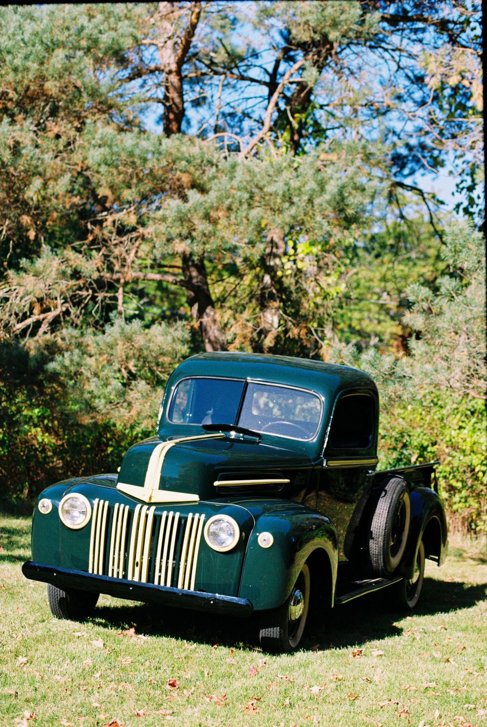 A vintage green and yellow truck soaking up the sun during this October wedding in Kennebunk. The couple drives away in style.