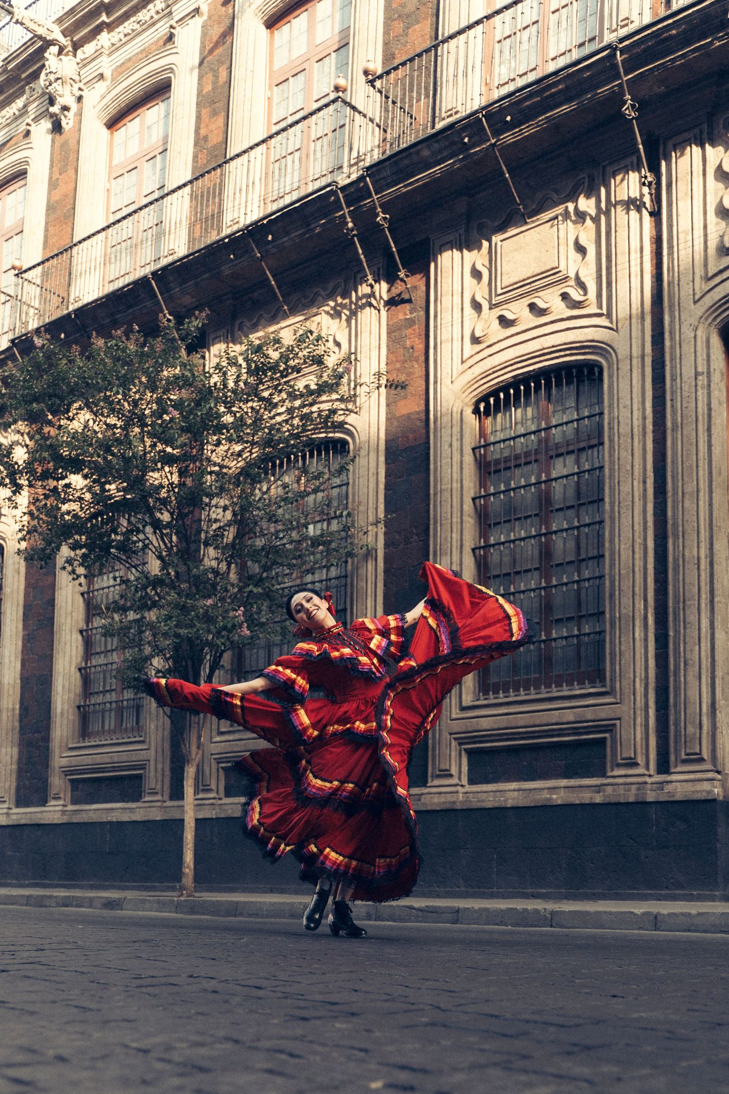 Ballet Folklórico de México dancer performing traditional movement on the streets of Mexico City