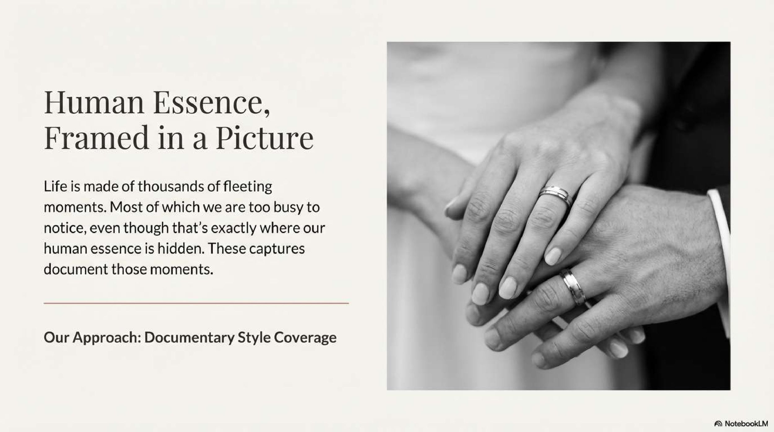 Black and white close-up of hands touching gently against a light background in a documentary style photograph.