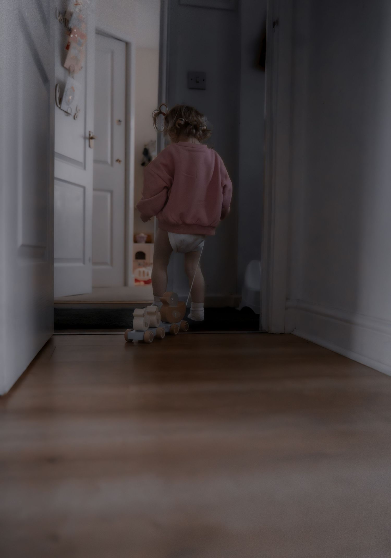 A series of dark hallway photos showing a person's shadow moving across the floor in a cinematic sequence.