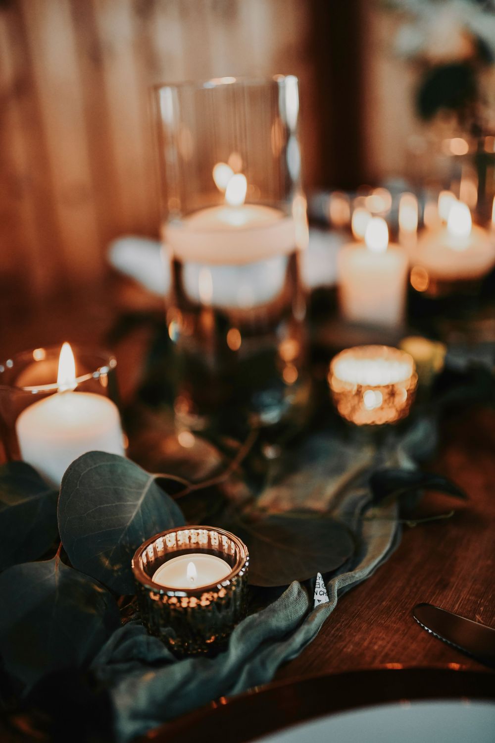 romantic candles line the reception tables at lucky spur ranch