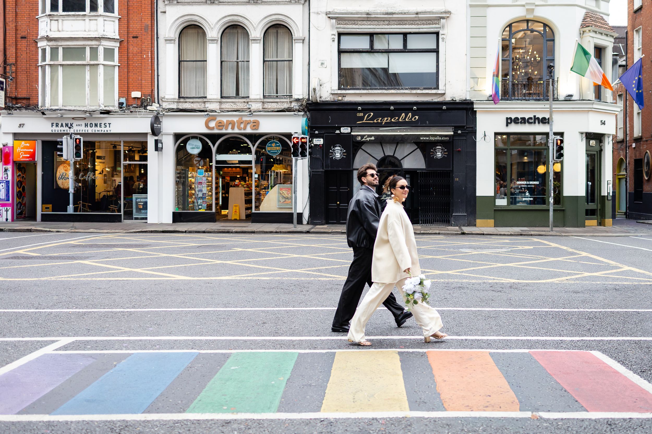Cinematic couple walking through Dublin — modern, romantic anniversary photoshoot.