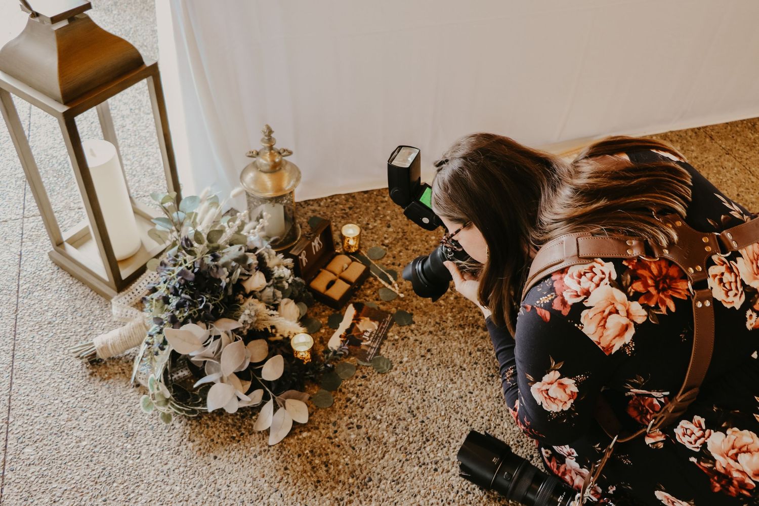 Photographer capturing details photos on the ground