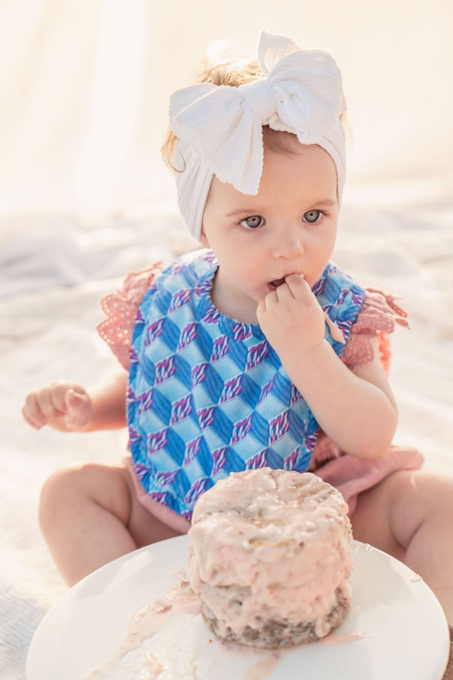 toddler girl cake smash one 1 year milestone outdoor photography, pink cake, conroe photographer