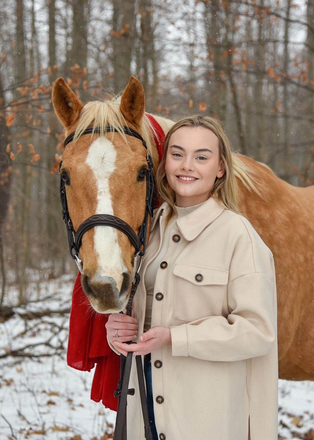 Avery and her palomino horse Vegas during their winter photoshoot.