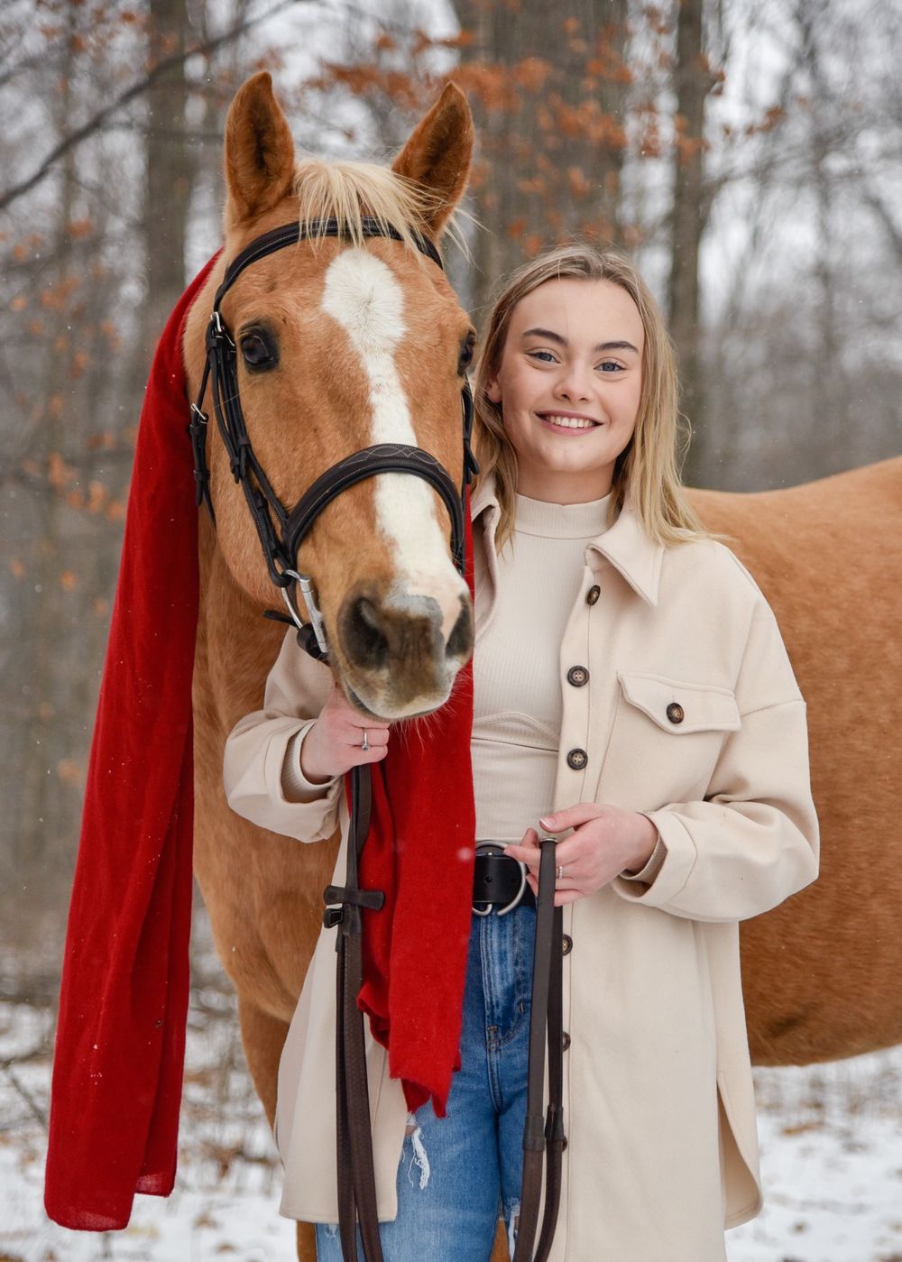 Avery and her palomino horse Vegas during their winter photoshoot.