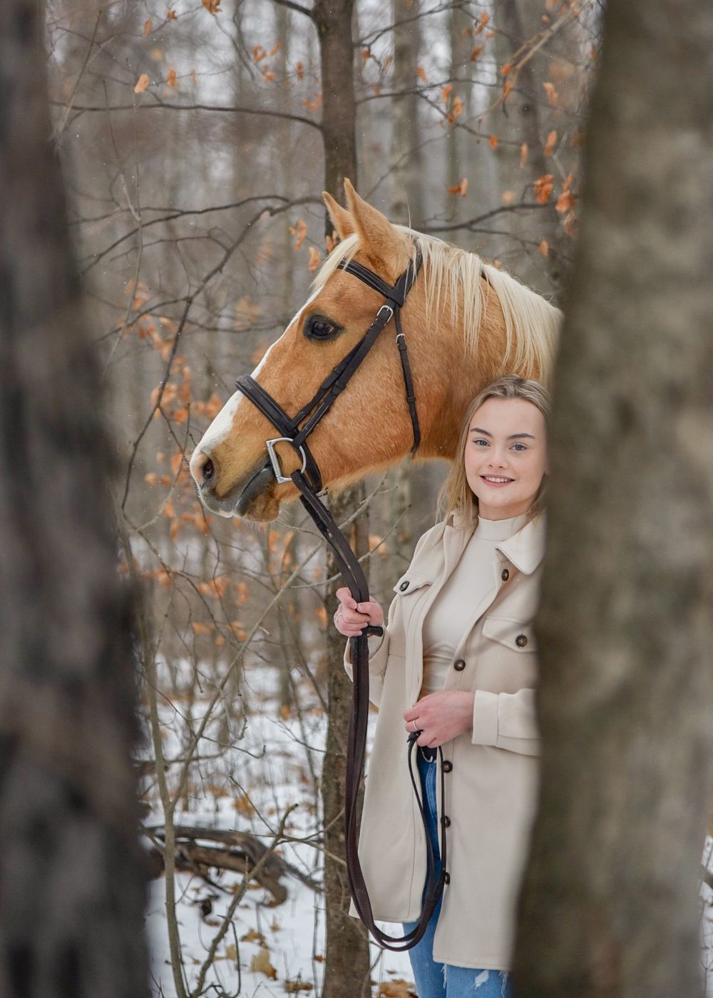 Avery and her palomino horse Vegas during their winter photoshoot.