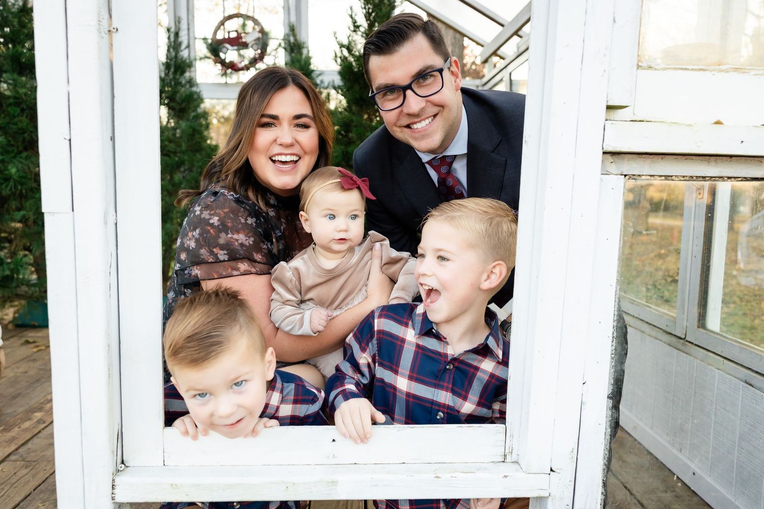 A collage of five family photos showing joyful moments and laughter in front of windows and outdoor settings.
