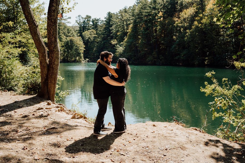 Couple embracing romantically at fuller lake getting an engagement proposal shoot in central pa
