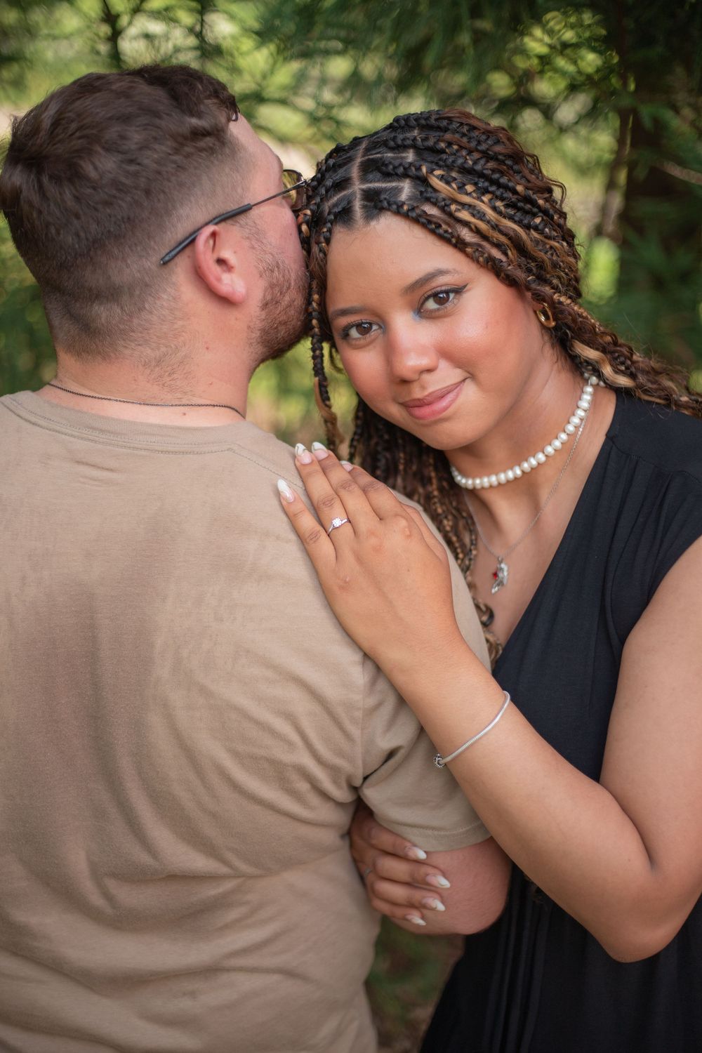 A romantic outdoor engagement photo showing a couple embracing at Maymont Japanese garden,RVA