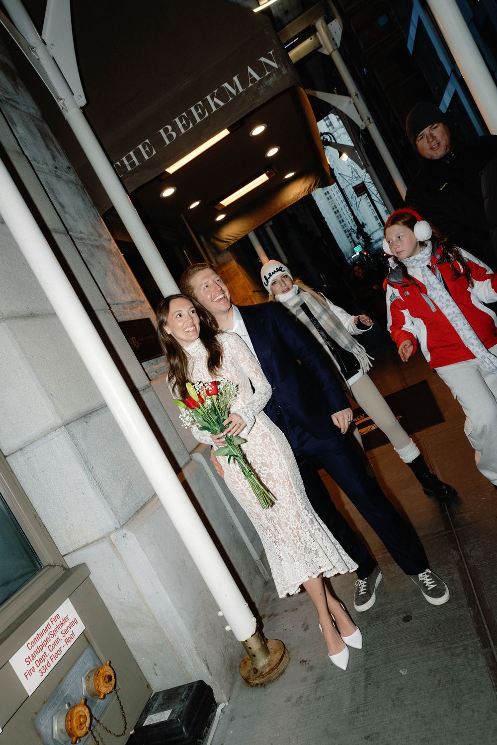 A sequence of nighttime photos showing people standing outside a dimly lit building entrance.