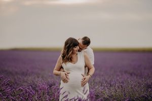 A romantic moment captured in a scenic lavender field.