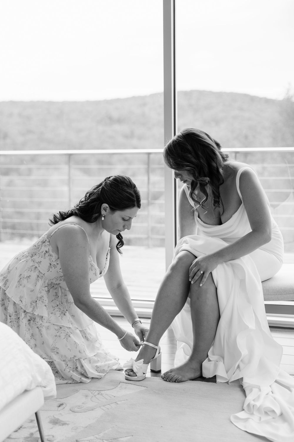 A series of candid moments showing two people in white dresses helping each other with shoes.
