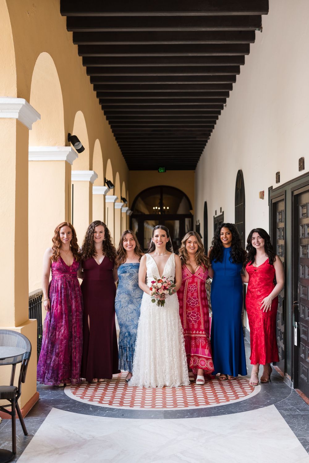 Wedding party group portrait in historic corridor at Hotel El Convento Puerto Rico