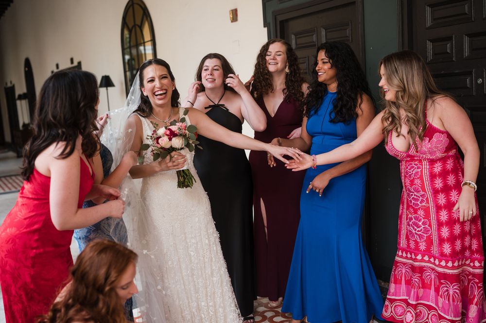 Bride celebrating with bridesmaids during wedding day at Hotel El Convento Puerto Rico