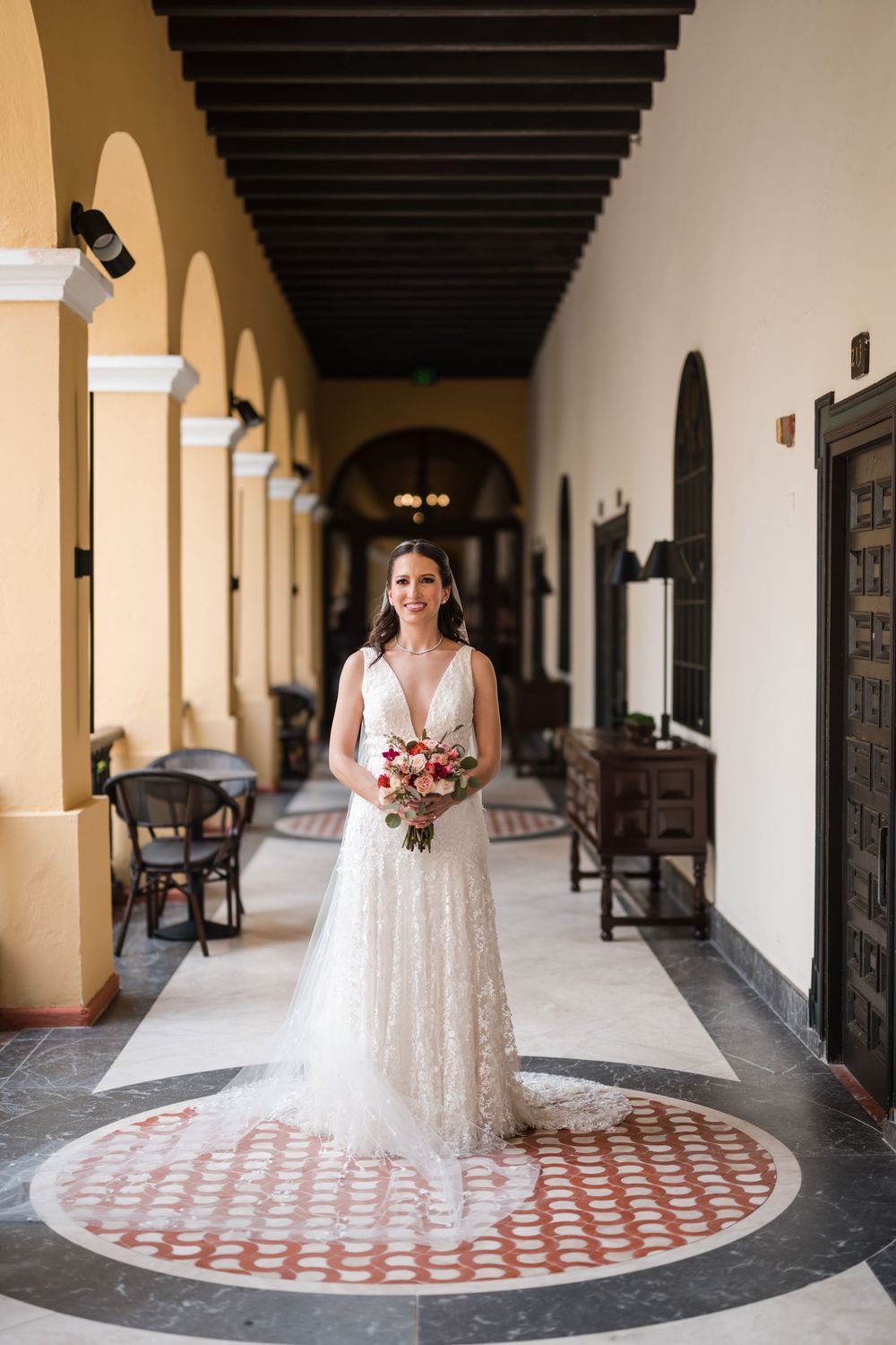 Bride standing in corridor at Hotel El Convento in Old San Juan Puerto Rico before first look
