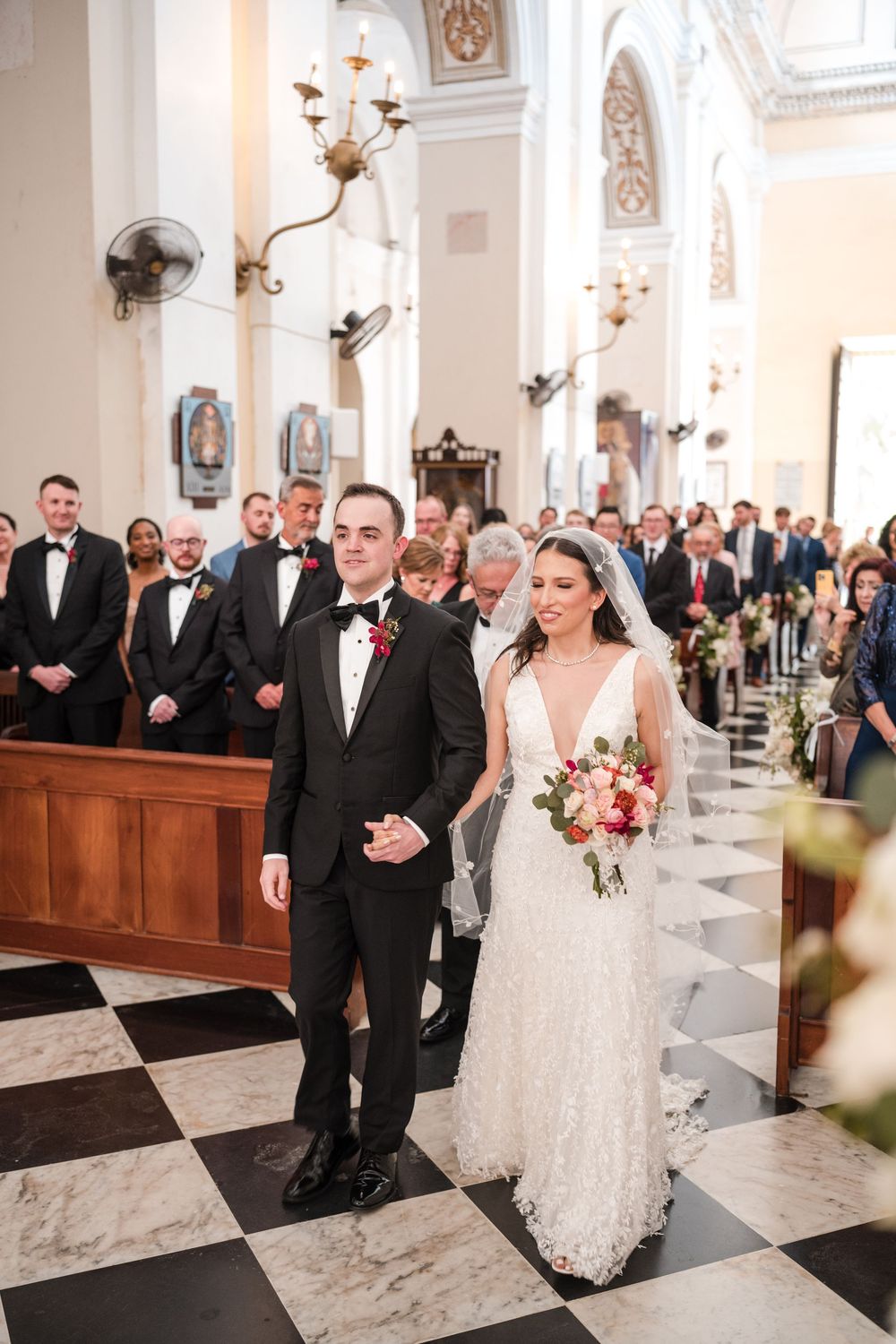 Bride and groom walking down the aisle at San Juan Cathedral in Old San Juan Puerto Rico
