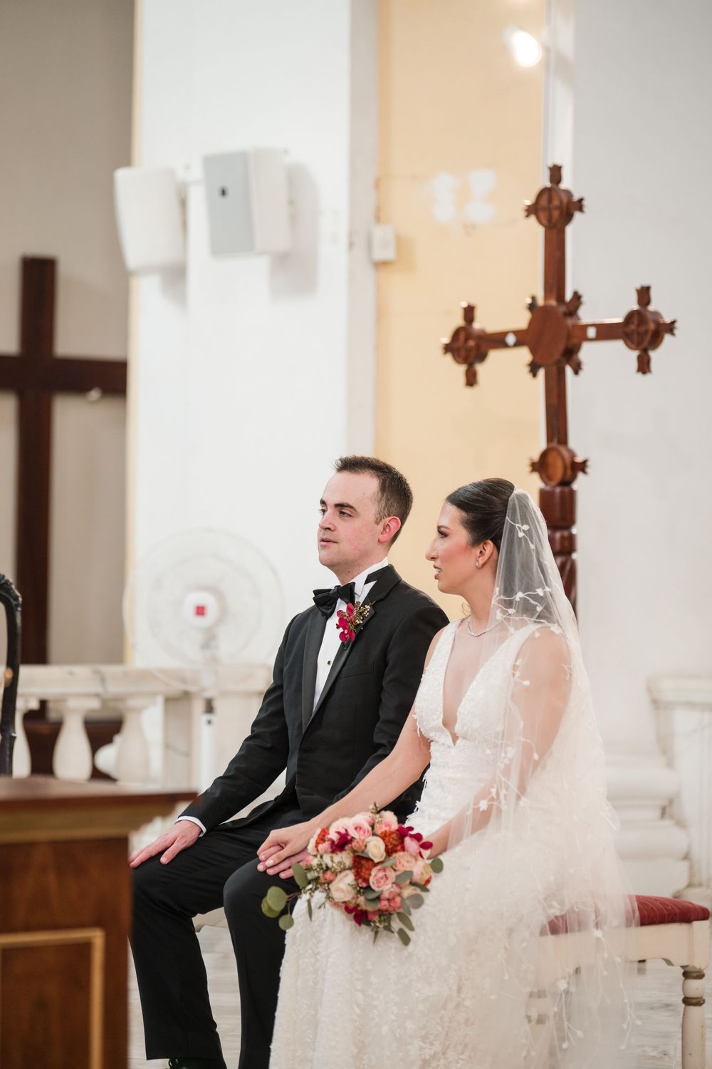 Couple standing together during ceremony inside San Juan Cathedral in Old San Juan Puerto Rico