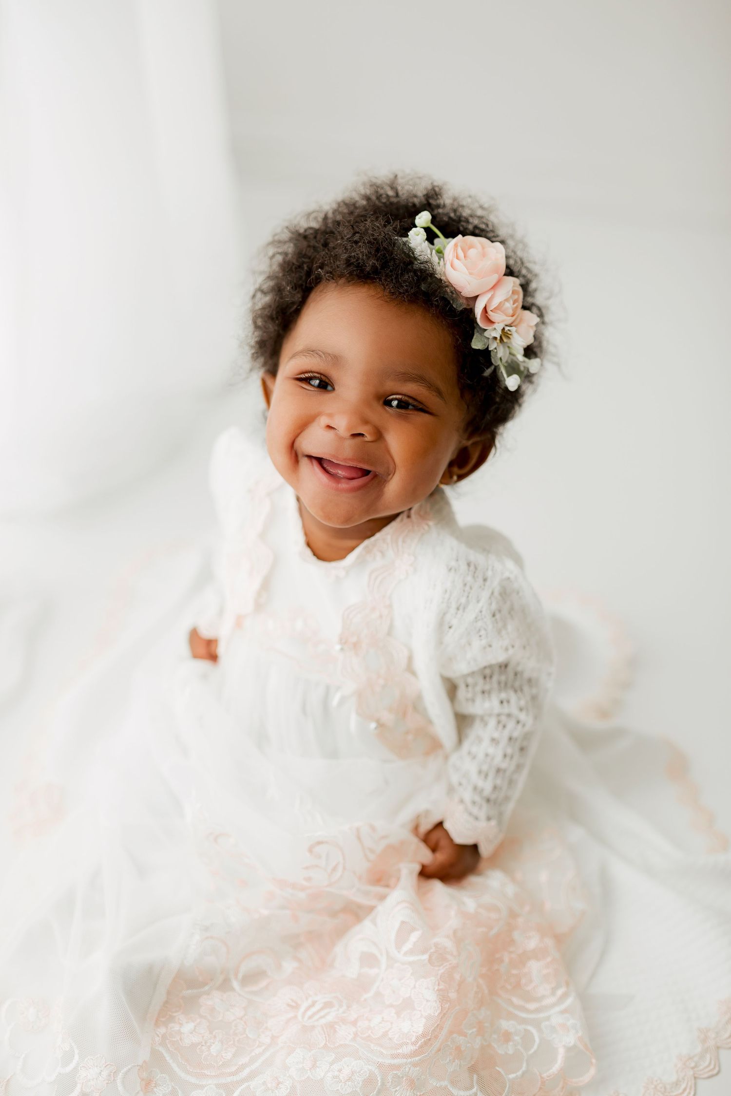 Baby sitter girl with white and pink lace dress and floral headband at Flowertown Photography Studio in Summerville, SC