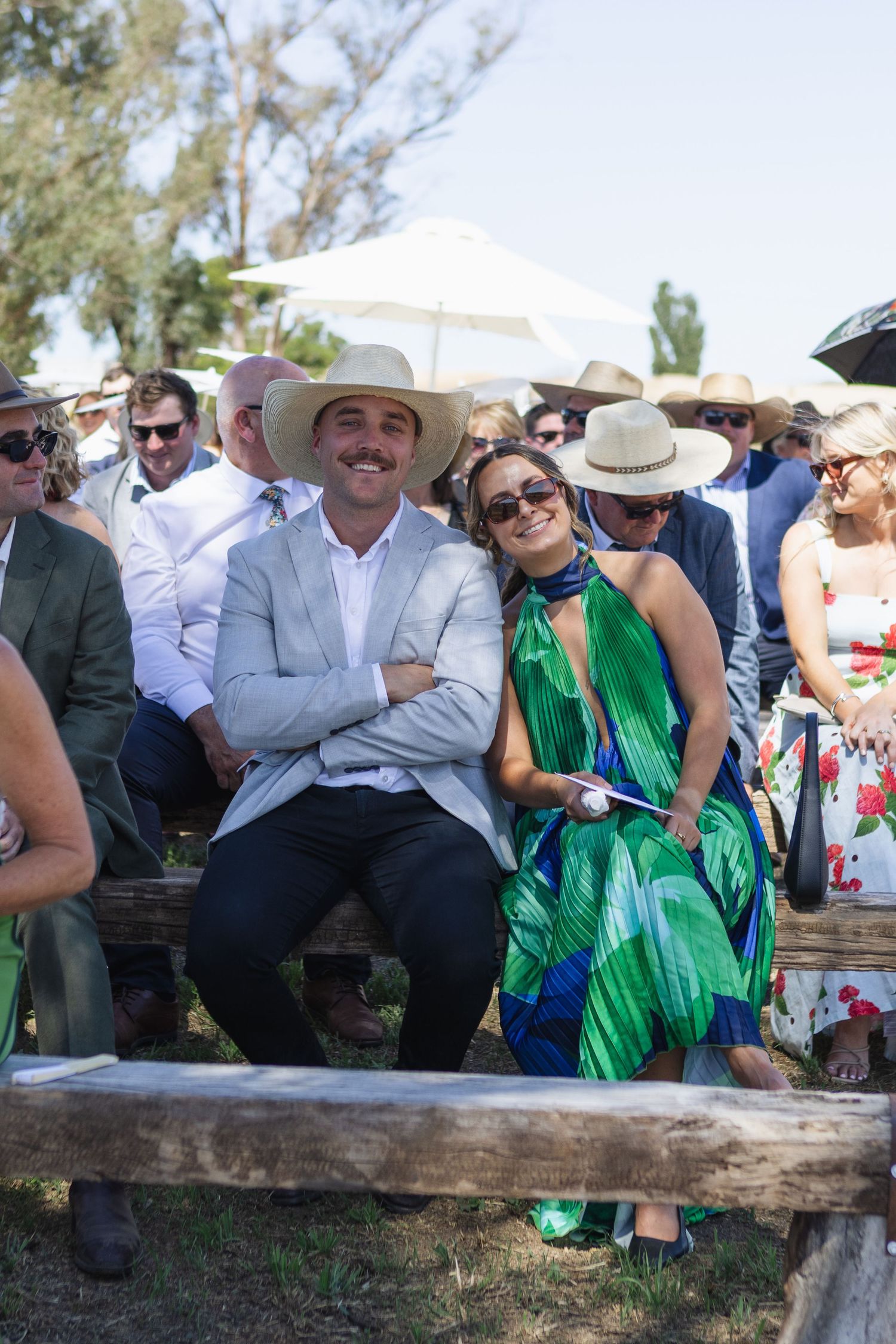 Guests smiling during ceremony at country NSW wedding