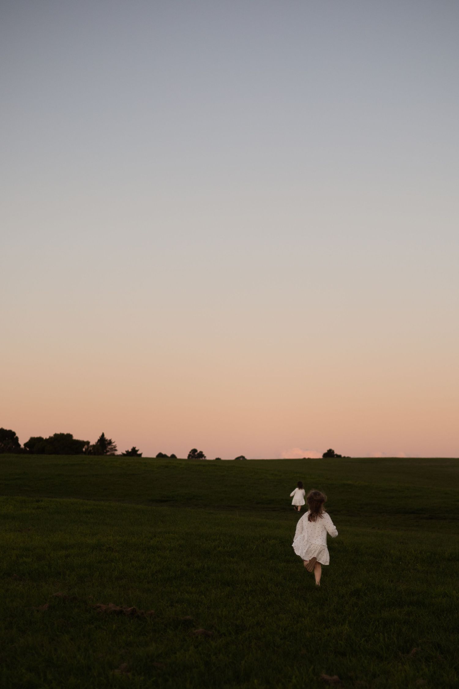 sisters running at sunset in christchurch