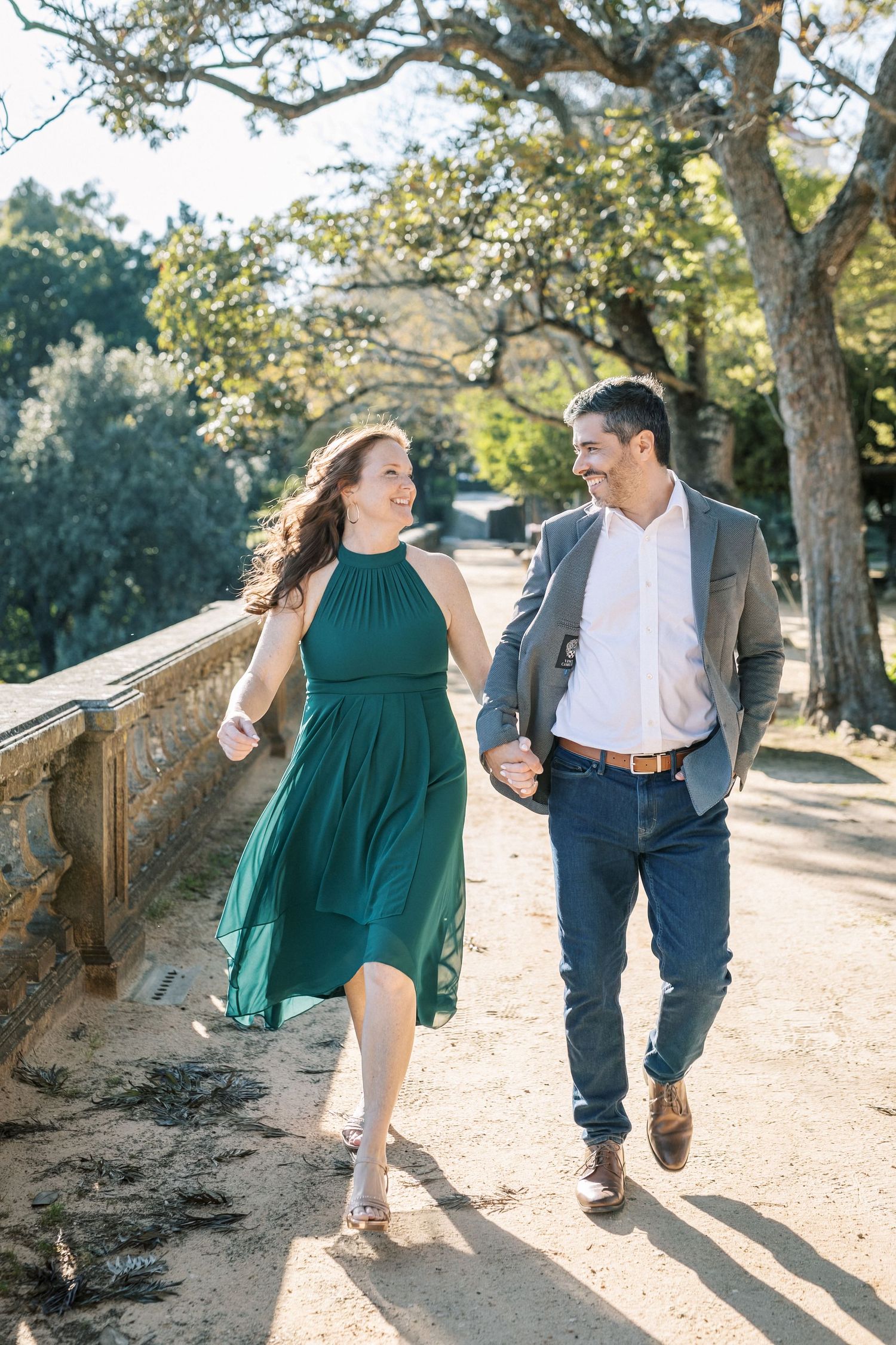 Couple walking in Vandelli Botanical Garden Lisbon engagement session