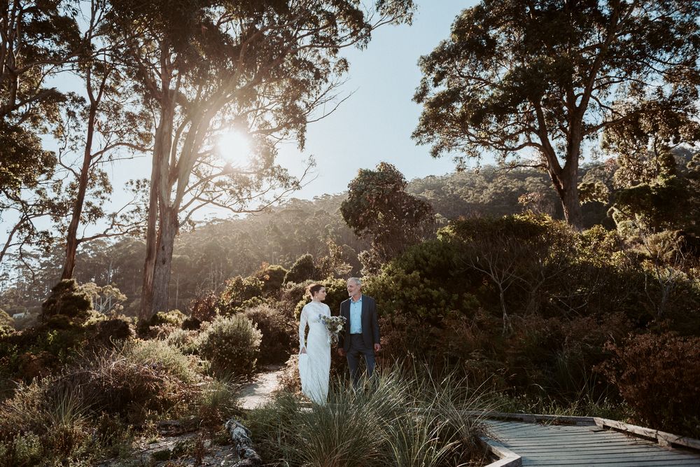 father walking daughter to get married at Tessellated Pavements, by Joss Jensen Photography