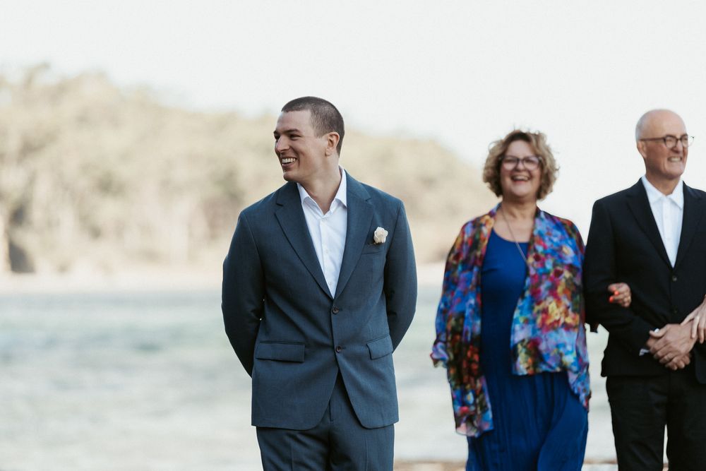 grooms first look at elopement at Tessellated Pavements captured by Tasmanian wedding photographer Joss Jensen Photography
