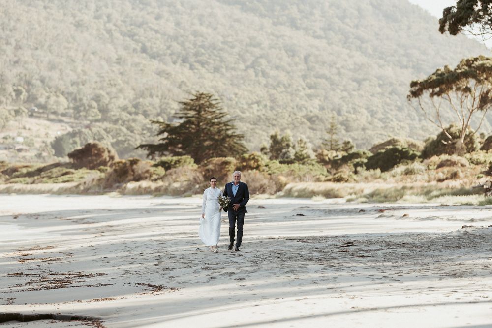 father walking daughter to get married at Tessellated Pavements, by Joss Jensen Photography