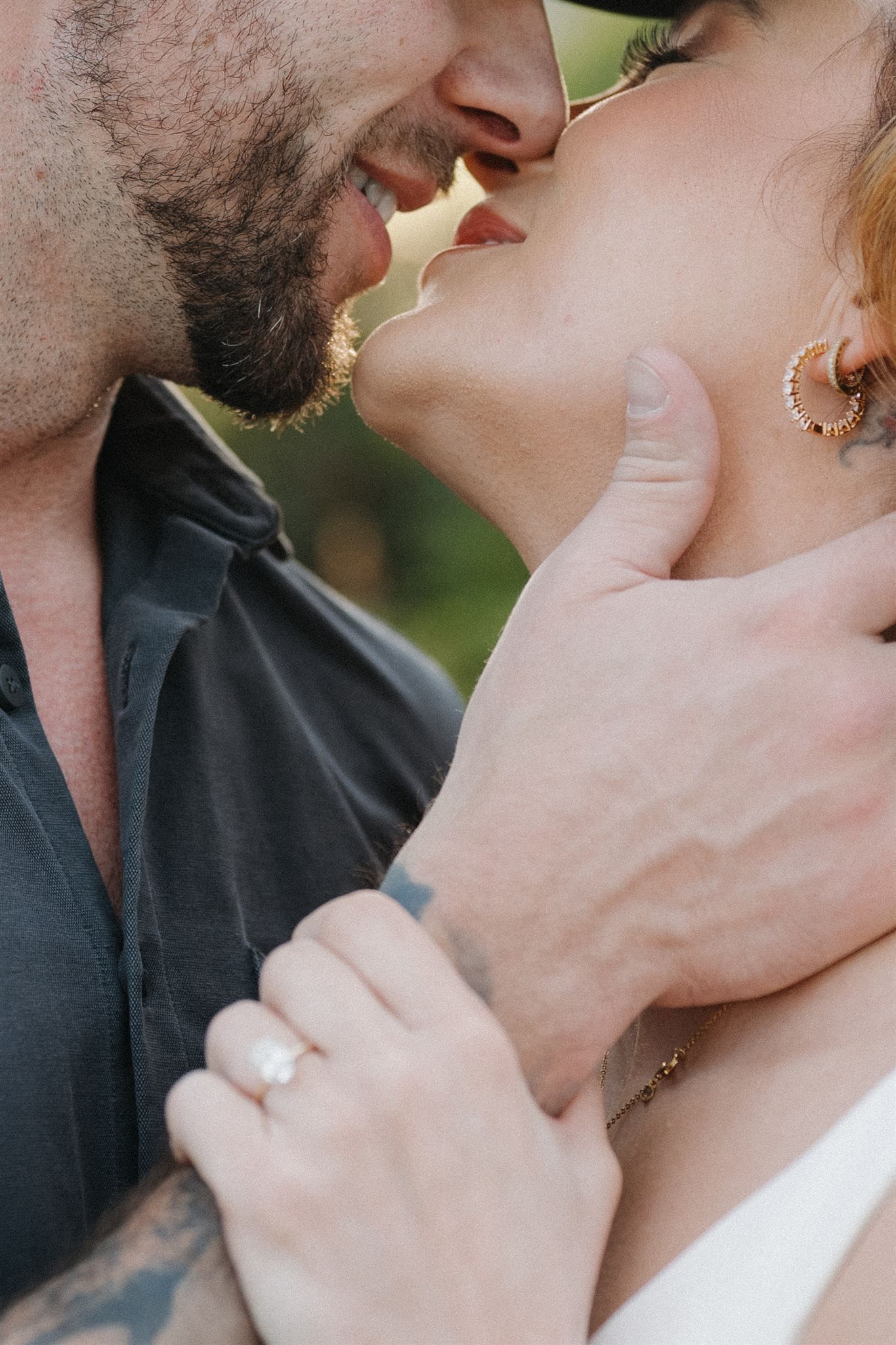A romantic close-up sequence shows a tender kiss between a couple, with the couple's faces against soft lighting.