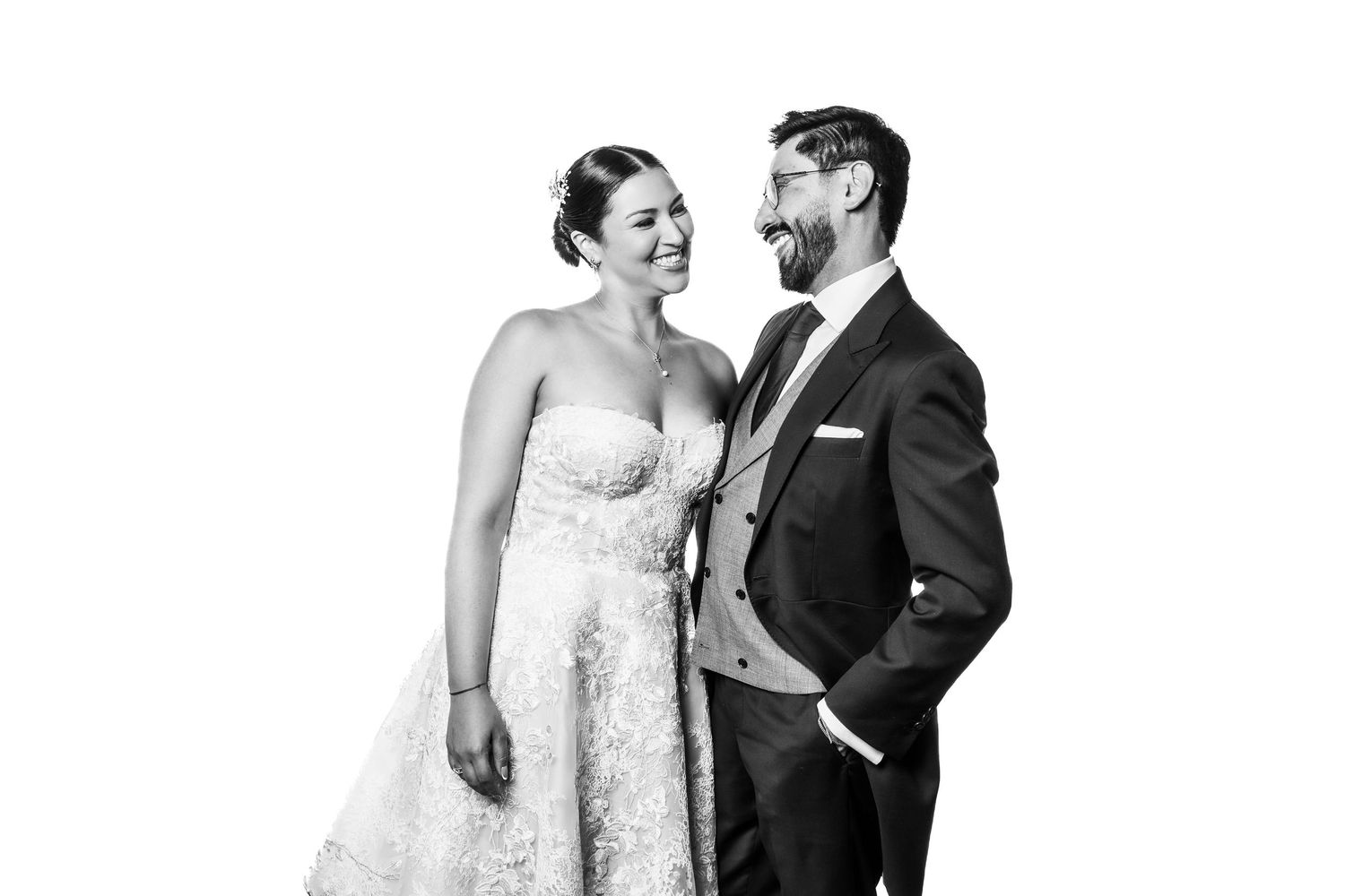 Black and white wedding portraits showing natural interactions between a couple.