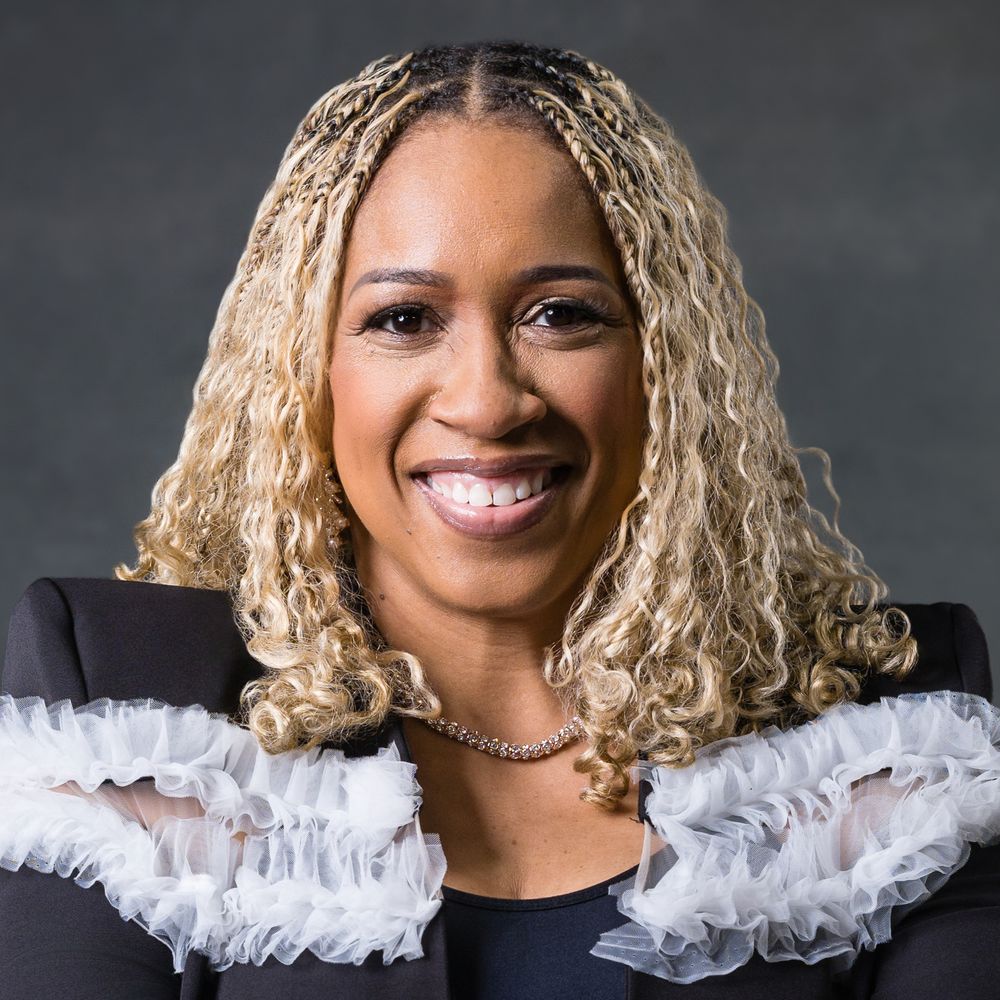 A series of headshots showing a person with curly blonde hair and white ruffled collar against a dark background.