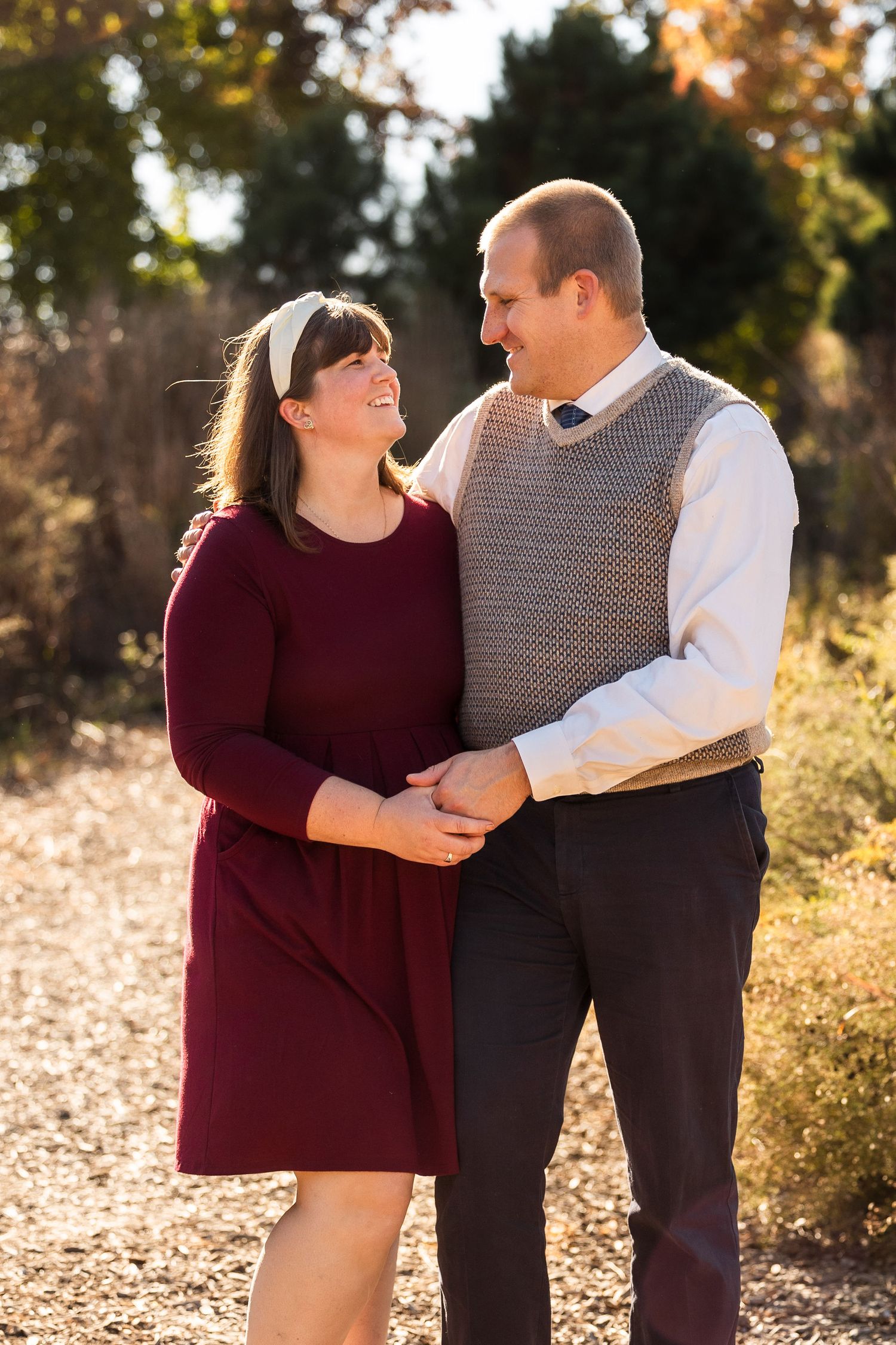 Couple sharing intimate moment during golden hour photo session.
