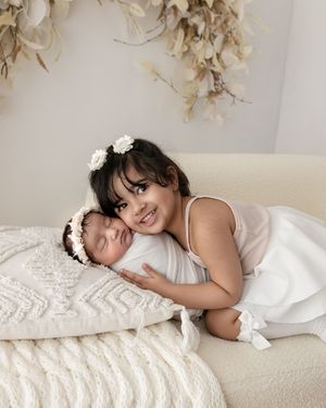 Newborn Baby with sibling on Bed, Prop, Newborn Baby Photography, East Cork, West Waterford.
