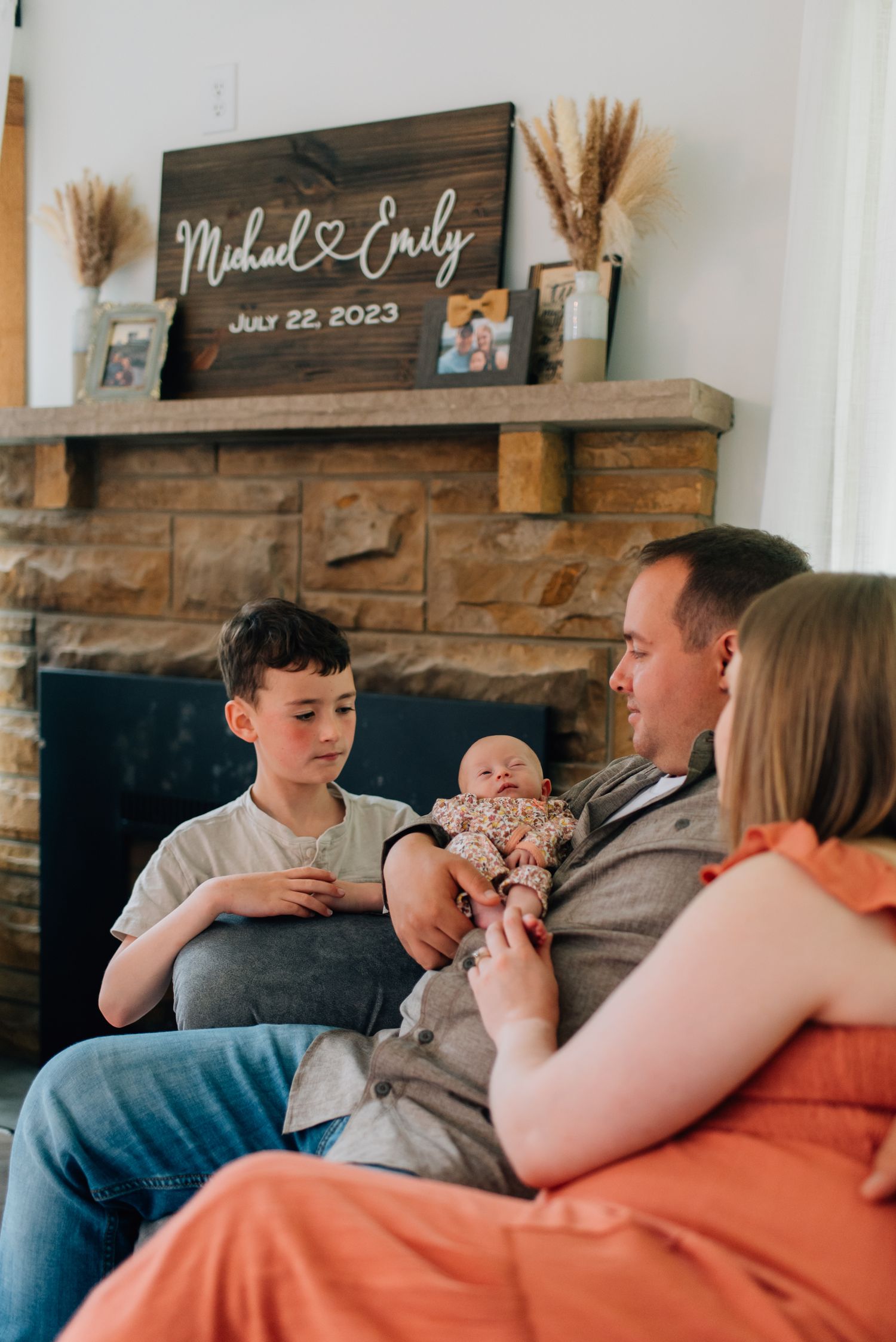 Pittsburgh family in front of fireplace for lifestyle at home family photos