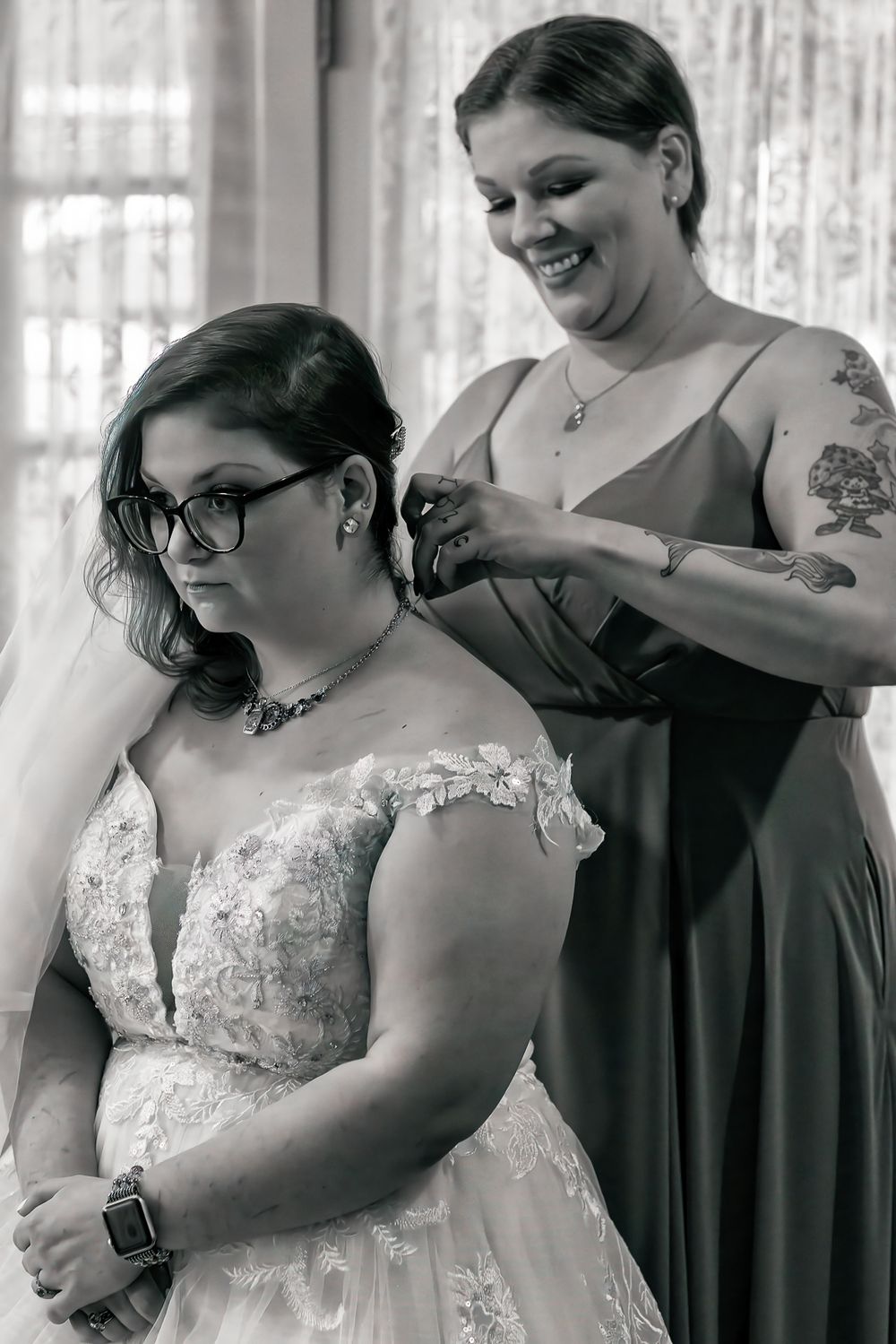 A series of photos showing bridesmaids helping to button up a white lace wedding dress.