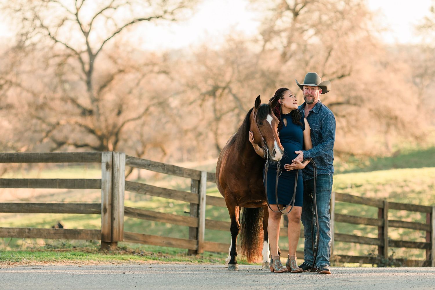 Cowboy couple with their horse captured by Northern California Horse Photographer Lauren Ann Photography for maternity session
