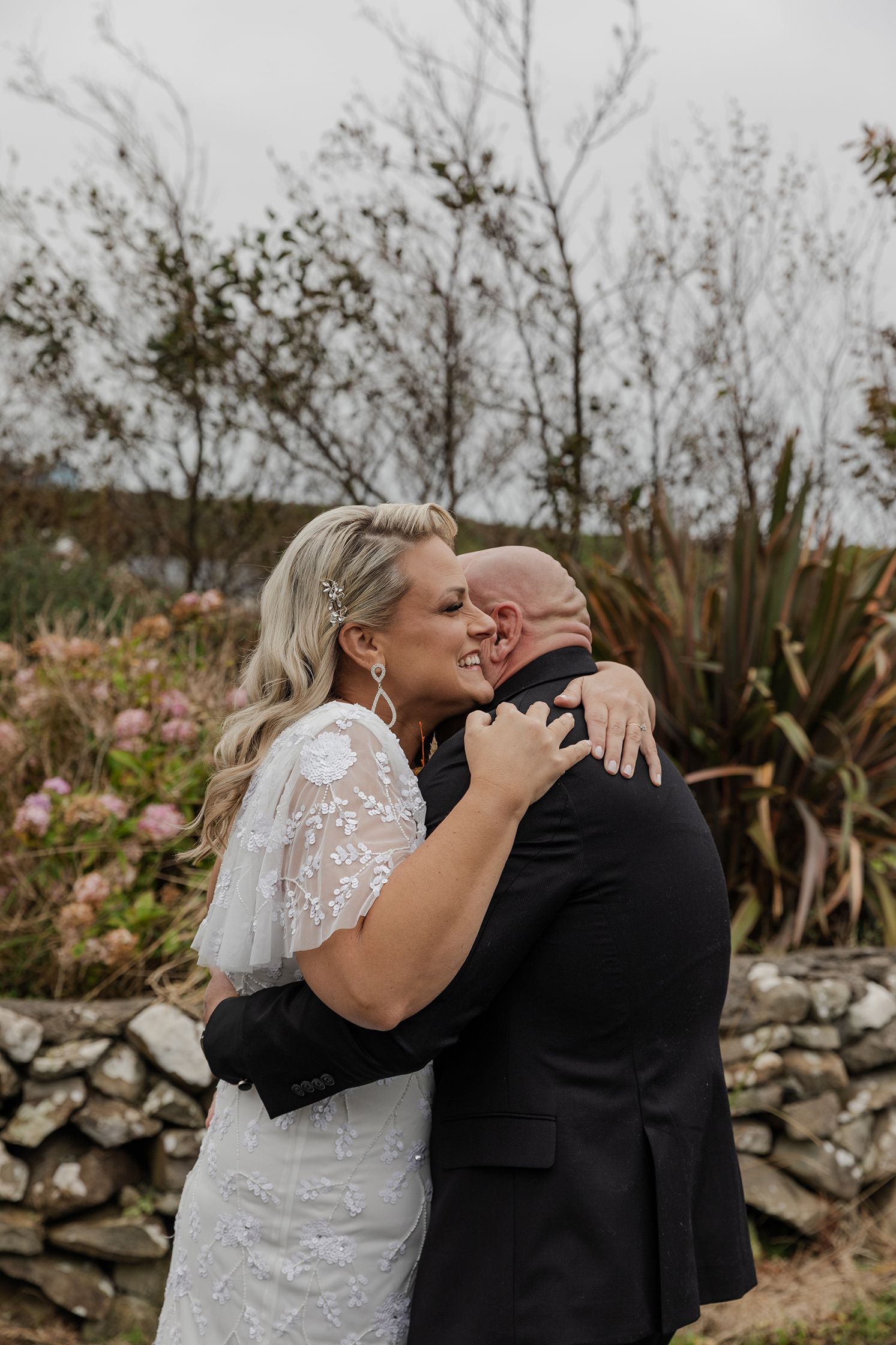 First look outside a cottage in Doolin during Ireland elopement.