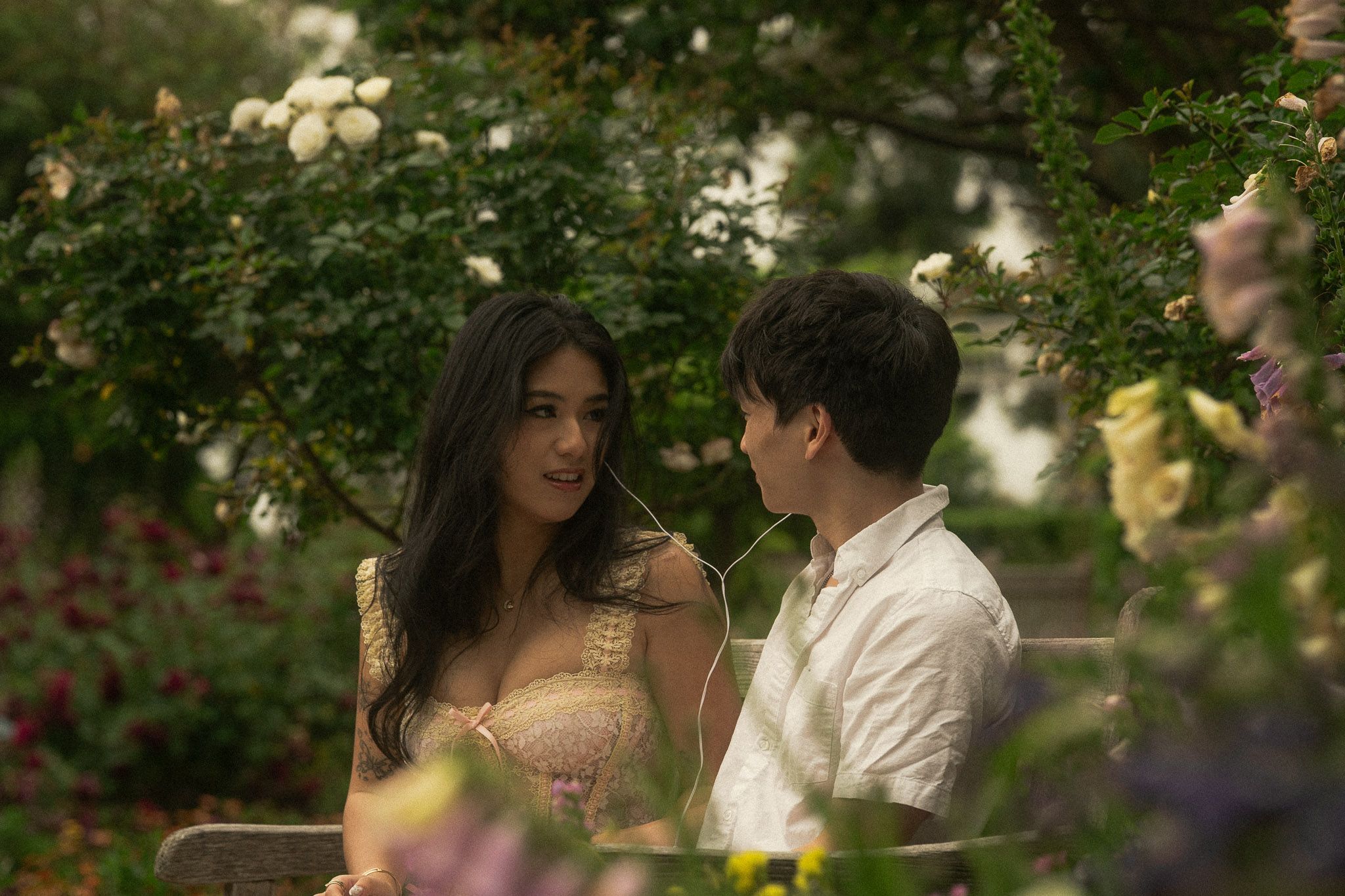 Huntington Library Engagement Photos | Couple Sharing Earphone listening to music